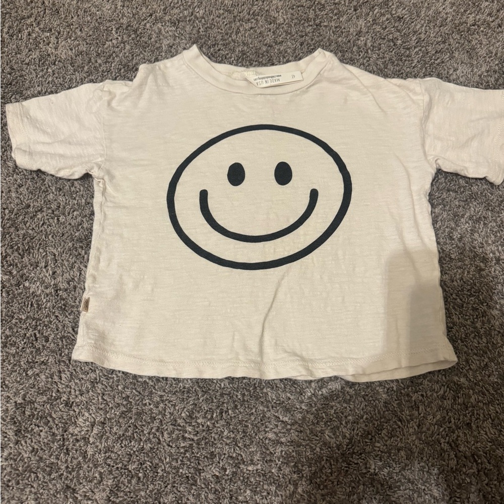 Childhoods smiley on ivory boxy tee